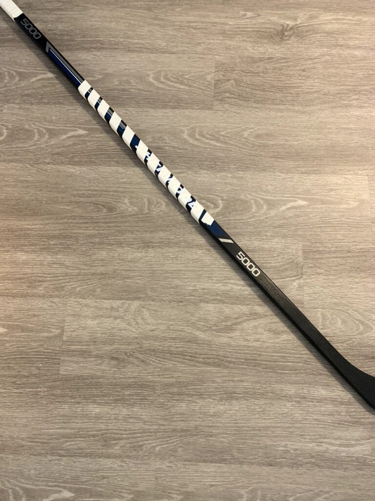 a candy cane tape job on the shaft of a hockey stick