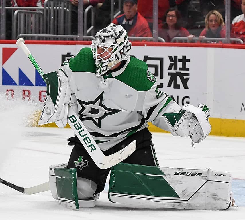 Goaltender Jake Oettinger making a save for the Dallas Stars during an NHL game