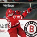 Martin Necas of the Carolina Hurricanes shooting the puck